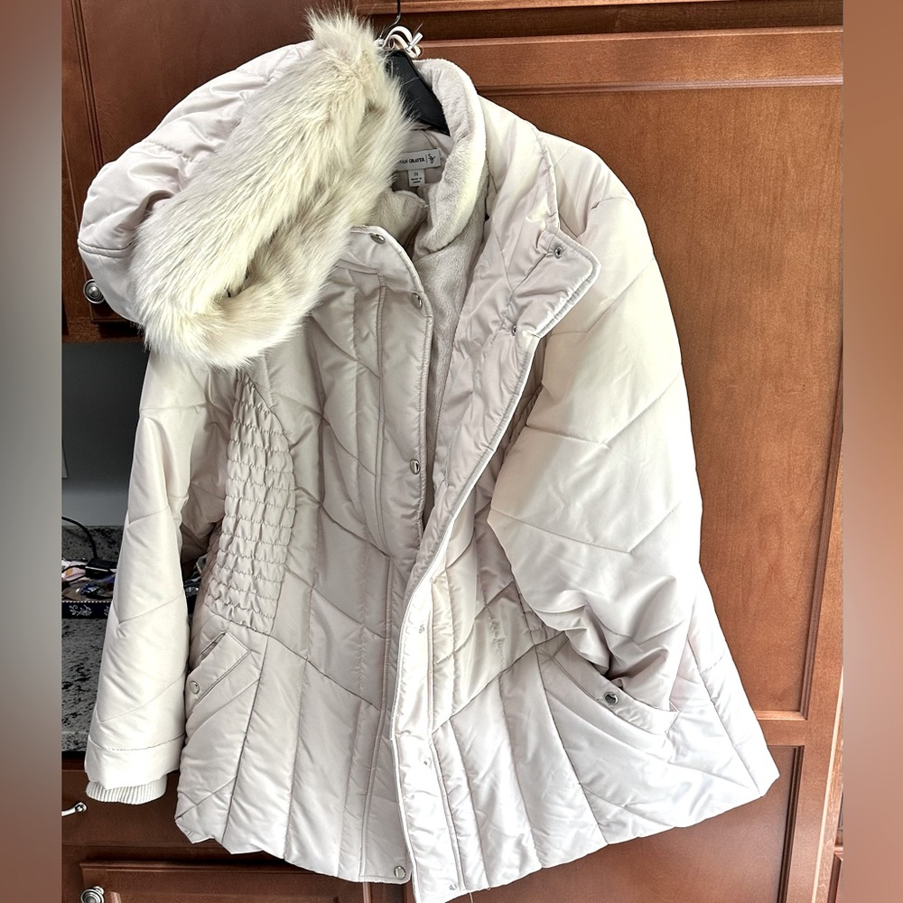 Warm winter coat.  Cream with a detachable faux fur trimmed hood
